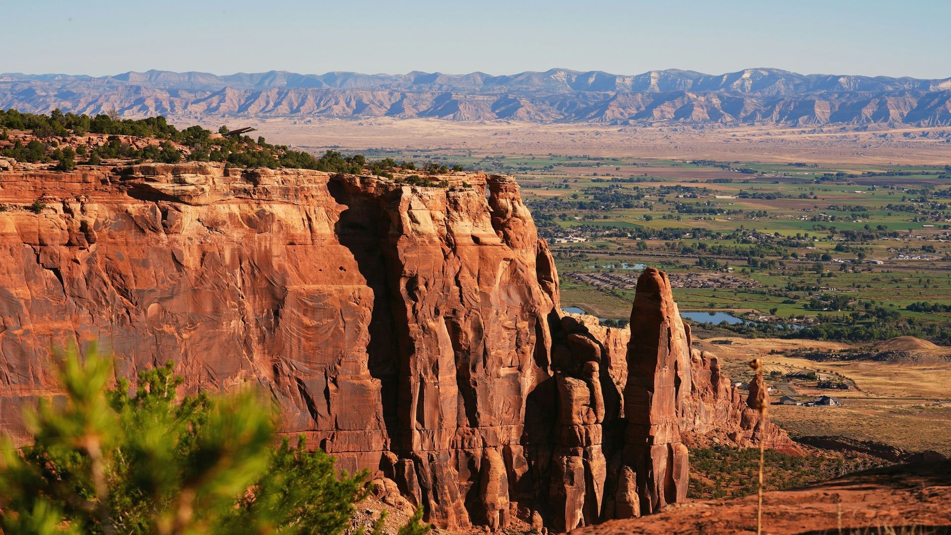 Red rock cliffs of the Colorado National Monument above the Grand Valley