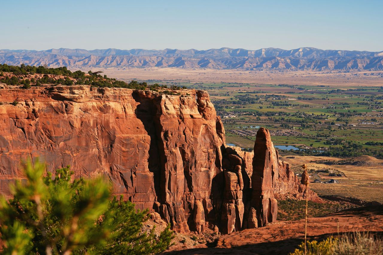 Red sandstone cliffs of Colorado National Monument, looking out over the valley